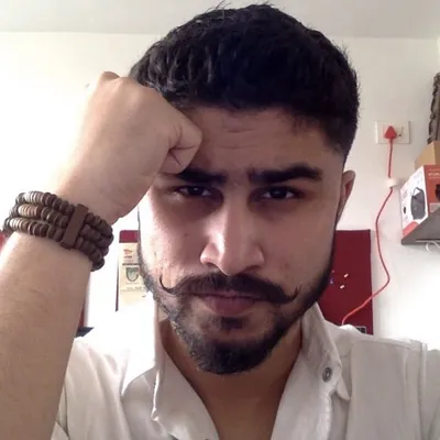 Ayman Sange profile