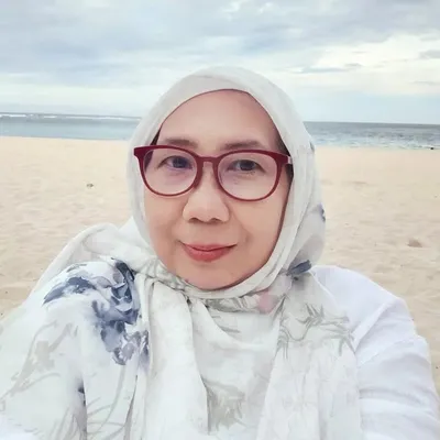 Titi Rusman profile